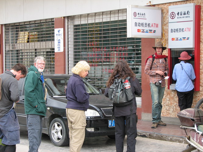 Everyone getting a big pile of cash for the trip out to Western Tibet. This was the last ATM for a few weeks. Shigatse, Tibet.